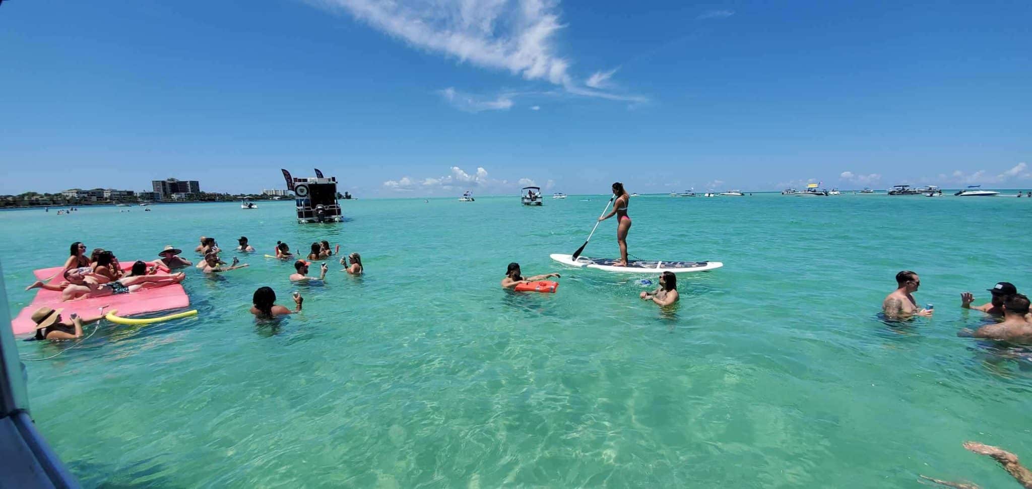 Sandbar scene with guests having fun